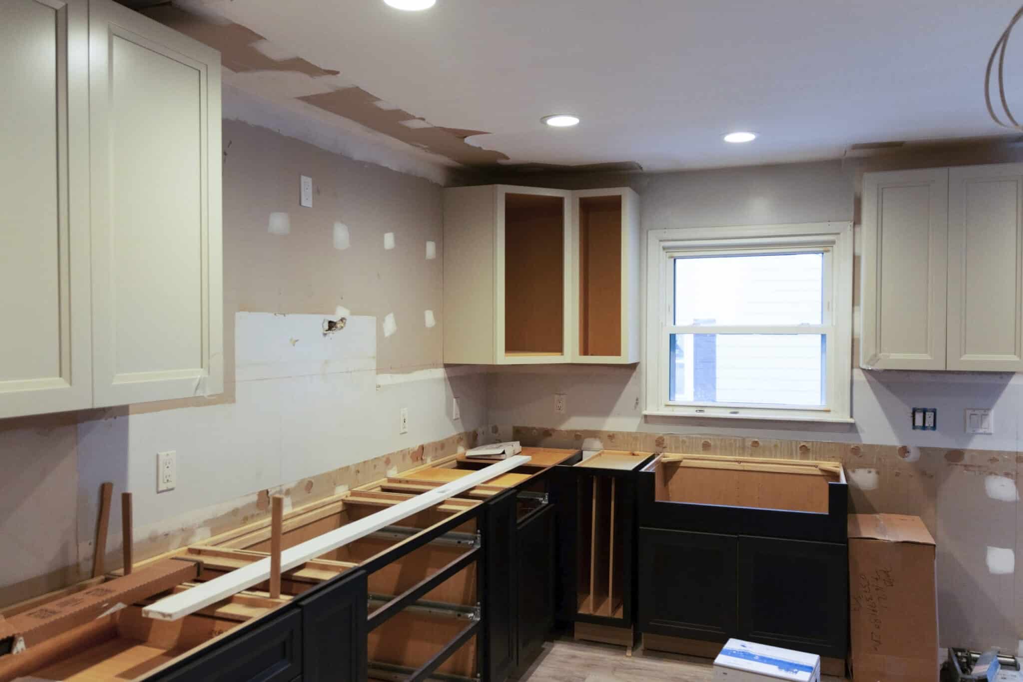 A residential house installing a new kitchen with some of the cabenits put into place but much more work to go.