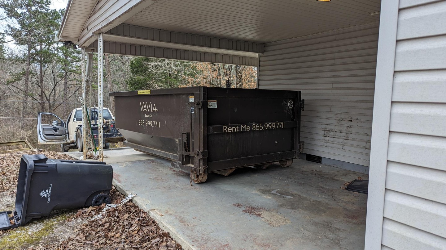 Walk-in dumpsters. Drivew